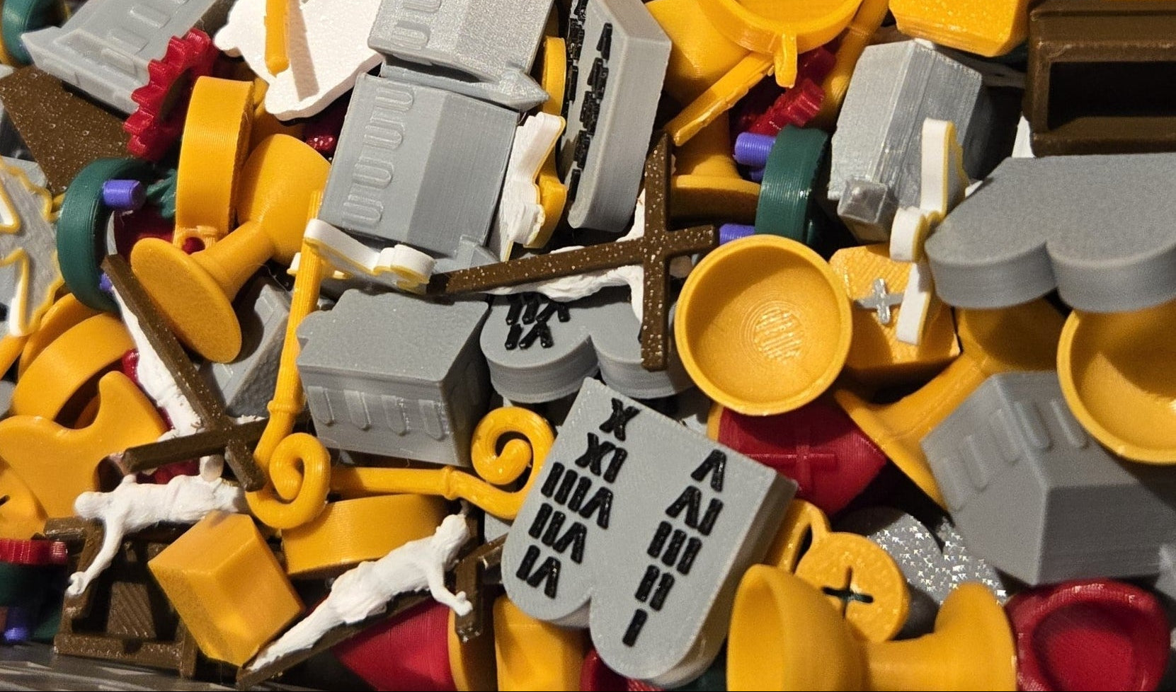 Bunch of I Spy bag pieces shown together prior to being added to an I Spy bag